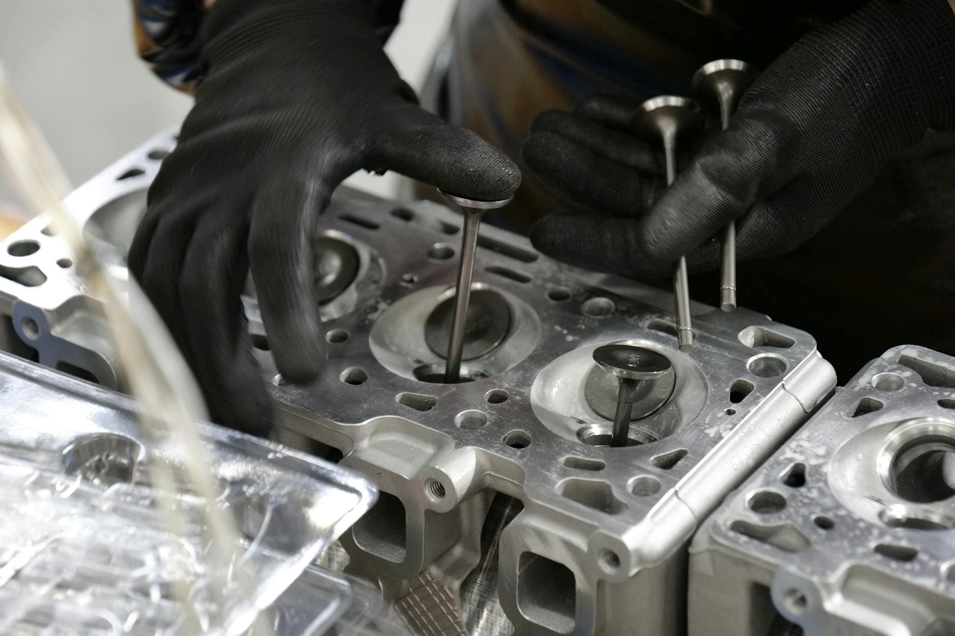 Diesel engine bay showing diagnostic OBD tablet connected for EGR and DPF fault diagnosis